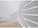 Hallway featuring modern wall design and hard wood floors at 19592 Breynia Dr, Lutz, FL 33558