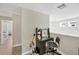 Hallway with desk and access to a bedroom, blending functionality with comfort at 19592 Breynia Dr, Lutz, FL 33558