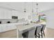 Modern kitchen with island and view of the backyard and patio at 19592 Breynia Dr, Lutz, FL 33558