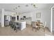 Bright kitchen with stainless steel appliances, a center island with seating, and pendant lighting at 19592 Breynia Dr, Lutz, FL 33558