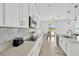 Kitchen with stainless appliances, and access to the backyard and patio at 19592 Breynia Dr, Lutz, FL 33558