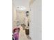 Cozy laundry room with washer, dryer, and shelves in a well-lit space at 19592 Breynia Dr, Lutz, FL 33558