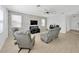 Stylish living room featuring a modern stone accent wall, recessed lighting, and tile floors at 19592 Breynia Dr, Lutz, FL 33558