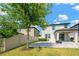Paver patio with a grill and outdoor seating, perfect for entertaining in the backyard at 19592 Breynia Dr, Lutz, FL 33558