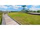 Community playground with slides, a gazebo, and a tennis court for recreation at 19592 Breynia Dr, Lutz, FL 33558