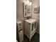 Stylish bathroom vanity with storage, decorative accents and unique seashell-themed decorations at 1960 Lakewood Club Dr S # 2-F, St Petersburg, FL 33712