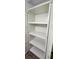 Open closet view displaying several white shelves for ample storage space at 1960 Lakewood Club Dr S # 2-F, St Petersburg, FL 33712