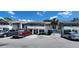 Well-maintained townhouse exterior with neutral colors, covered balconies, and convenient parking at 1960 Lakewood Club Dr S # 2-F, St Petersburg, FL 33712