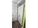 View of a hallway showing a large closet with white doors and black handles at 1960 Lakewood Club Dr S # 2-F, St Petersburg, FL 33712