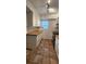 A full kitchen view showing the wooden countertops, white cabinetry, stainless steel oven, and tile flooring at 1960 Lakewood Club Dr S # 2-F, St Petersburg, FL 33712