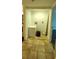 Functional laundry area with tiled floor and bright light fixture. Perfect for keeping things tidy at 1960 Lakewood Club Dr S # 2-F, St Petersburg, FL 33712