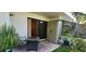 Cozy patio area with sliding glass doors, a storage unit, and a small decorative table at 1960 Lakewood Club Dr S # 2-F, St Petersburg, FL 33712