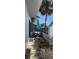 Relaxing patio area with a table, chairs, and stone landscaping with a pleasant outdoor atmosphere at 1960 Lakewood Club Dr S # 2-F, St Petersburg, FL 33712