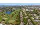 Panoramic aerial view of the golf course, residential area, and waterfront views at 21 Pelican Pl, Belleair, FL 33756