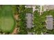 Aerial view of the property showcasing lush trees and views of the golf course at 21 Pelican Pl, Belleair, FL 33756