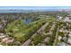 Stunning aerial view showcasing the golf course community, water, and skyline in the distance at 21 Pelican Pl, Belleair, FL 33756