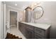 Bathroom featuring a double vanity with marble countertop, and stylish fixtures at 21 Pelican Pl, Belleair, FL 33756