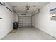 Clean and organized garage with epoxy flooring and ample storage space at 21 Pelican Pl, Belleair, FL 33756