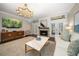 Cozy living room boasts modern lighting, a sleek fireplace, and stylish decor, perfect for relaxing at 21 Pelican Pl, Belleair, FL 33756