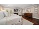 Beautiful bedroom featuring a fireplace, doors to a balcony, and lots of natural light at 21 Pelican Pl, Belleair, FL 33756
