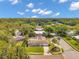 Aerial view of the neighborhood showcasing the homes and mature trees at 2216 El De Oro Dr, Clearwater, FL 33764