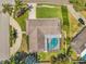 Aerial view showcasing a landscaped backyard and a pool at 2216 El De Oro Dr, Clearwater, FL 33764
