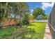 Large backyard with lush green grass and privacy fence, perfect for outdoor activities at 2216 El De Oro Dr, Clearwater, FL 33764