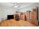 Sunlit bedroom features hardwood floors and a ceiling fan at 2216 El De Oro Dr, Clearwater, FL 33764