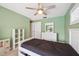 Bedroom features a ceiling fan, a closet, and a dresser with a mirror at 2216 El De Oro Dr, Clearwater, FL 33764
