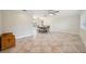 The dining room area has tile flooring, a ceiling fan, and a view of the pool and backyard at 2216 El De Oro Dr, Clearwater, FL 33764