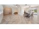 Spacious dining room with tile floors, a ceiling fan, and views of the backyard at 2216 El De Oro Dr, Clearwater, FL 33764