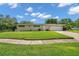Traditional single-story home with a well-kept lawn and attached two-car garage at 2216 El De Oro Dr, Clearwater, FL 33764