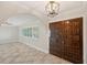 The foyer is tiled with high ceilings and an archway to the main living area, next to a double door entrance at 2216 El De Oro Dr, Clearwater, FL 33764