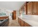 View of the kitchen showing countertops, wooden cabinetry, and stainless steel appliances at 2216 El De Oro Dr, Clearwater, FL 33764