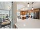 Bright kitchen with granite countertops, wood cabinets, stainless steel appliances, and patio view at 2216 El De Oro Dr, Clearwater, FL 33764