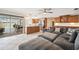 Comfortable living room with view to the kitchen, patio, and ample seating at 2216 El De Oro Dr, Clearwater, FL 33764