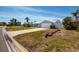 Charming single-story home featuring a well-manicured front lawn and attached garage at 2972 E Vina Del Mar Blvd, St Pete Beach, FL 33706
