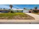 Charming single-story home with a well-maintained lawn, an attached garage, and a welcoming front entrance at 2972 E Vina Del Mar Blvd, St Pete Beach, FL 33706