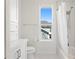 Bright bathroom with shower/tub combo and view out the window at 3411 W El Prado Blvd, Tampa, FL 33629