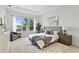 Spacious bedroom features large windows, tray ceiling, and calming neutral decor at 3411 W El Prado Blvd, Tampa, FL 33629