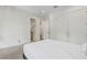 Bright bedroom featuring hardwood floors, ensuite bathroom, and spacious closet at 3411 W El Prado Blvd, Tampa, FL 33629