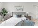 Inviting bedroom featuring a comfortable bed with stylish throw pillows and lamps at 3411 W El Prado Blvd, Tampa, FL 33629
