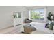 Bright bedroom with large window offering natural light and calming interior design elements at 3411 W El Prado Blvd, Tampa, FL 33629