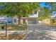 Modern two-story home with a paved driveway and a beautifully landscaped front yard at 3411 W El Prado Blvd, Tampa, FL 33629