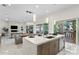 Open kitchen featuring a large island, stainless steel appliances, and sliding glass doors to outdoors at 3411 W El Prado Blvd, Tampa, FL 33629