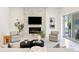 Cozy living room showcases a modern fireplace, plush seating, and ample natural light at 3411 W El Prado Blvd, Tampa, FL 33629