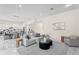 Bright, open-concept living room featuring modern decor and luxury marble flooring at 3411 W El Prado Blvd, Tampa, FL 33629