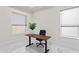 Bright home office with modern desk, chair, and ample natural light from two large windows at 3411 W El Prado Blvd, Tampa, FL 33629