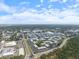 Aerial view of apartment complex featuring ample parking and surrounding greenery at 3585 41St S Ter # 227, St Petersburg, FL 33711