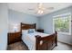 Bedroom featuring a large window providing natural light and a traditional bed frame at 3585 41St S Ter # 227, St Petersburg, FL 33711